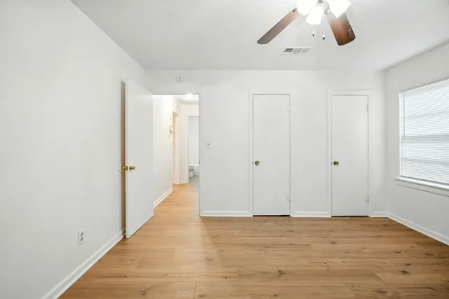 a view of an empty room and window
