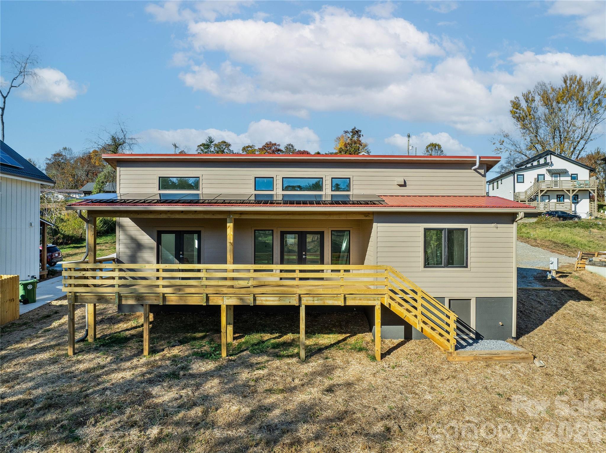 326 Emma Road Asheville, NC 28806 - Photo 1 of 15 a view of a house with a wooden fence