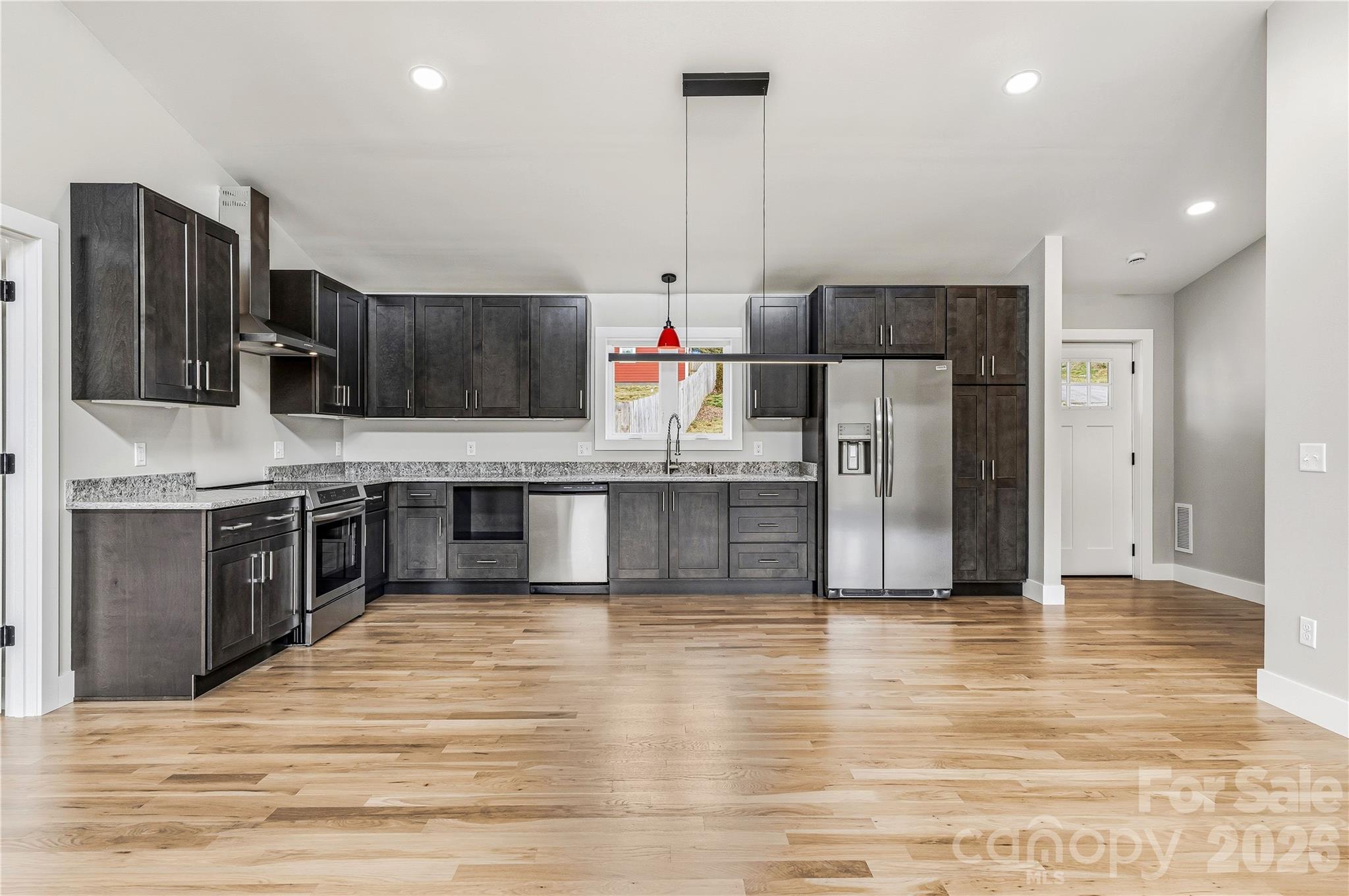 326 Emma Road Asheville, NC 28806 - Photo 5 of 15 a kitchen with stainless steel appliances granite countertop a refrigerator a stove a sink and a microwave