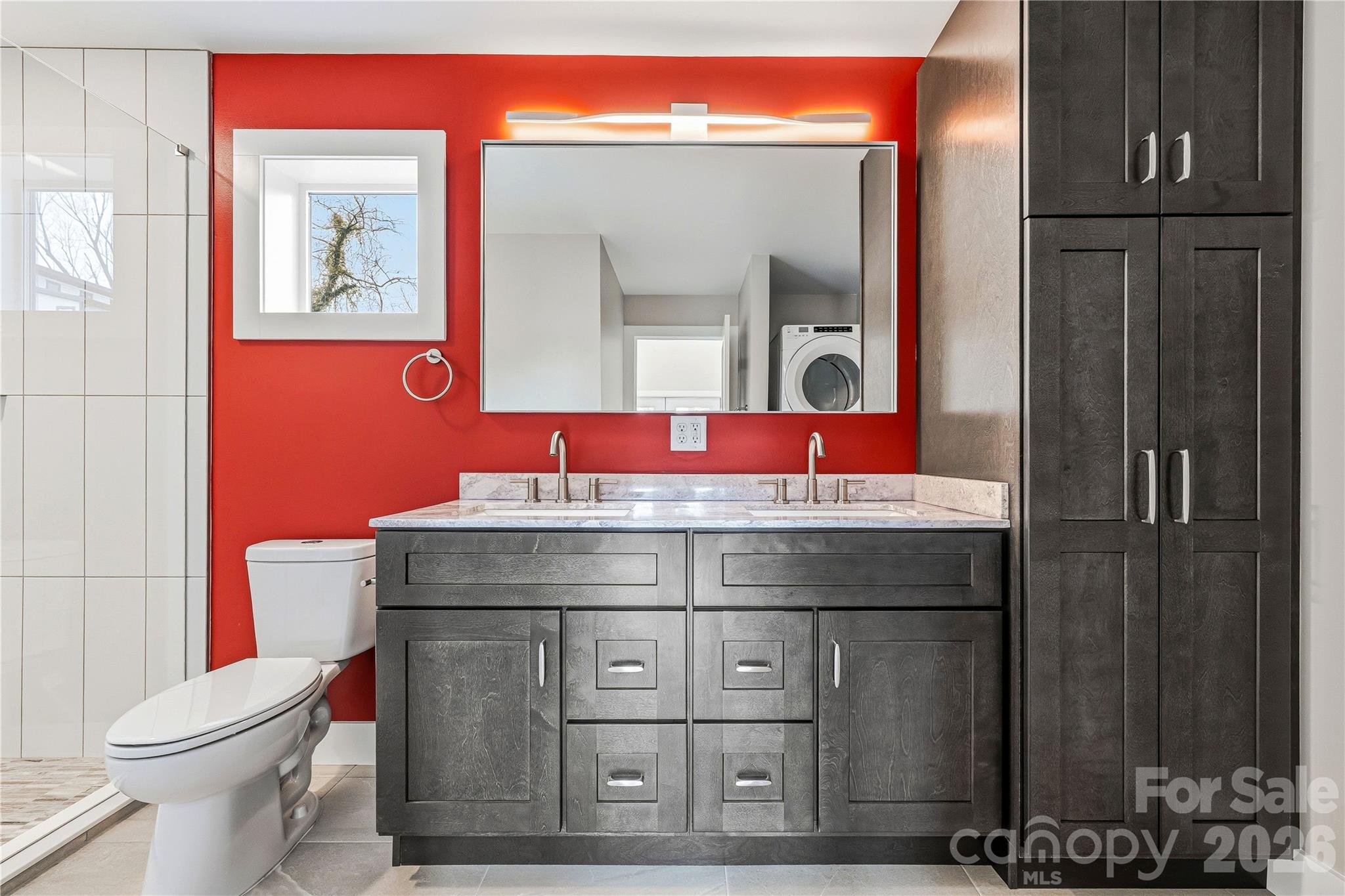 326 Emma Road Asheville, NC 28806 - Photo 9 of 15 a bathroom with a sink mirror vanity and toilet