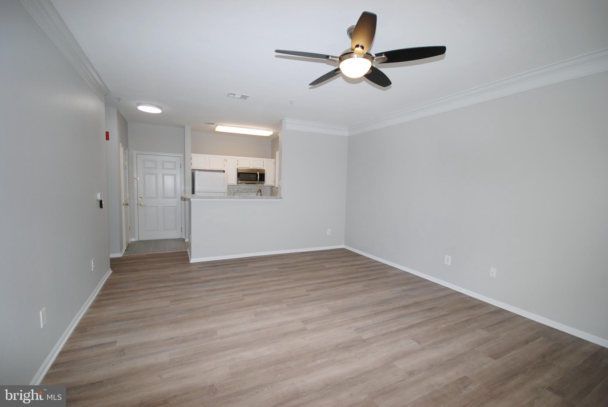 1571 Spring Gate Dr., Unit 6209 McLean, VA 22102 - Photo 12 of 31 a view of empty room with wooden floor and fan