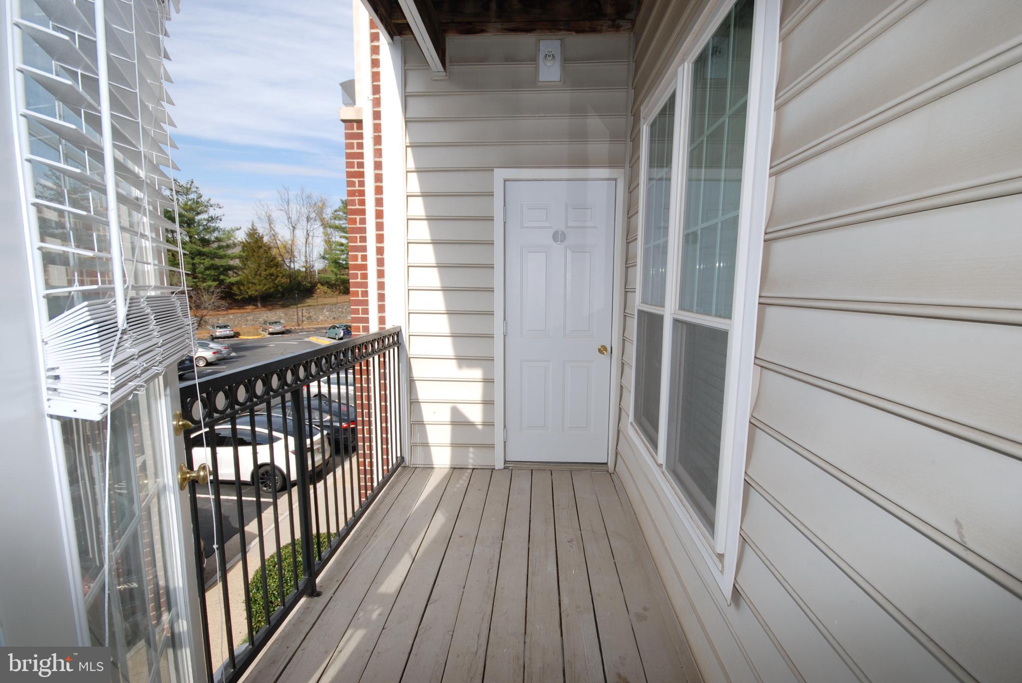 1571 Spring Gate Dr., Unit 6209 McLean, VA 22102 - Photo 23 of 31 a view of a balcony with wooden floor