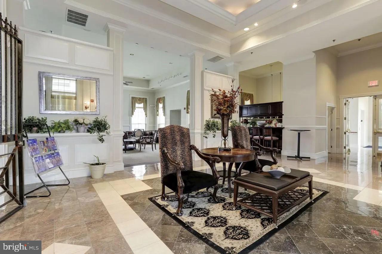1571 Spring Gate Dr., Unit 6209 McLean, VA 22102 - Photo 28 of 31 a living room with furniture and a table