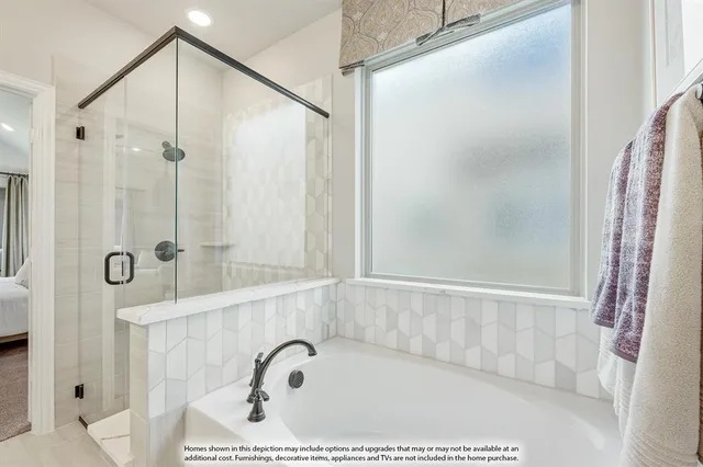 a bathroom with a bathtub and a shower