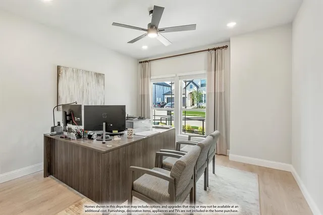 a work room with furniture and a flat screen tv
