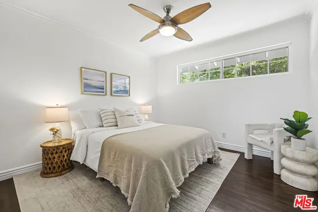 a bedroom with bed and a window