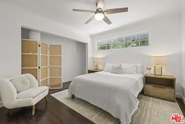 a bedroom with a bed and a couch