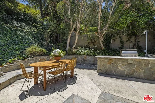 a view of outdoor sitting area with furniture