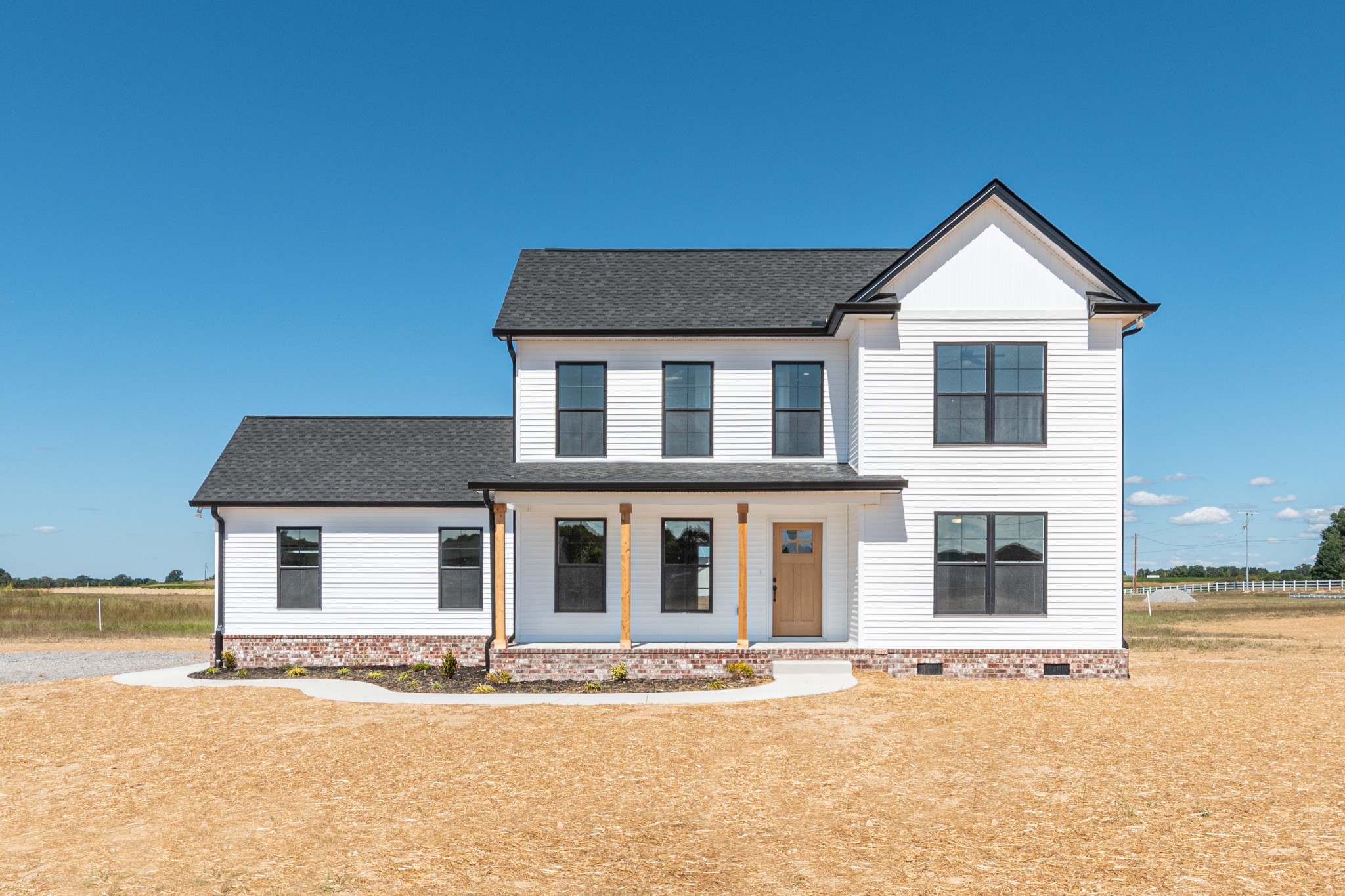483 Meadows Road Portland, TN 37148 - Photo 1 of 29 a front view of a house with a yard