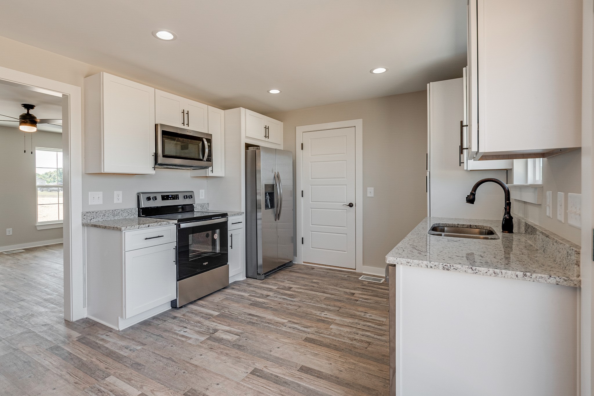 483 Meadows Road Portland, TN 37148 - Photo 14 of 29 a kitchen with a refrigerator stove and sink