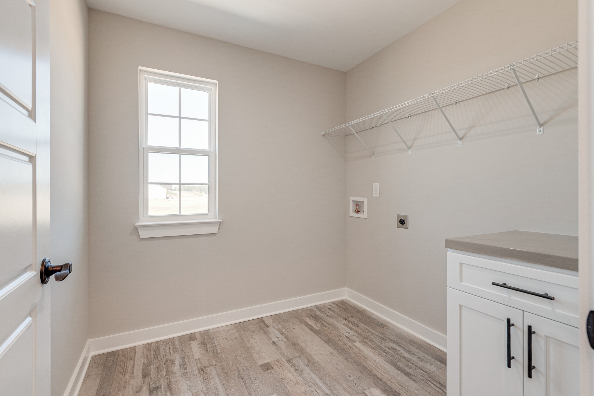 483 Meadows Road Portland, TN 37148 - Photo 17 of 29 a view of an empty room with wooden floor and a window