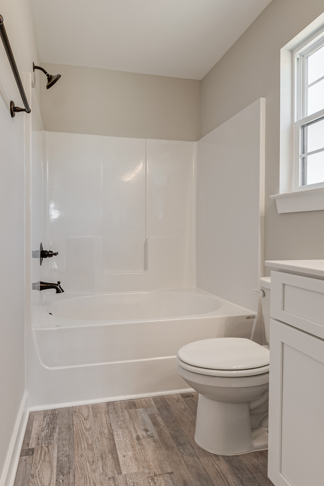 483 Meadows Road Portland, TN 37148 - Photo 21 of 29 a bathroom with a toilet and a bath tub