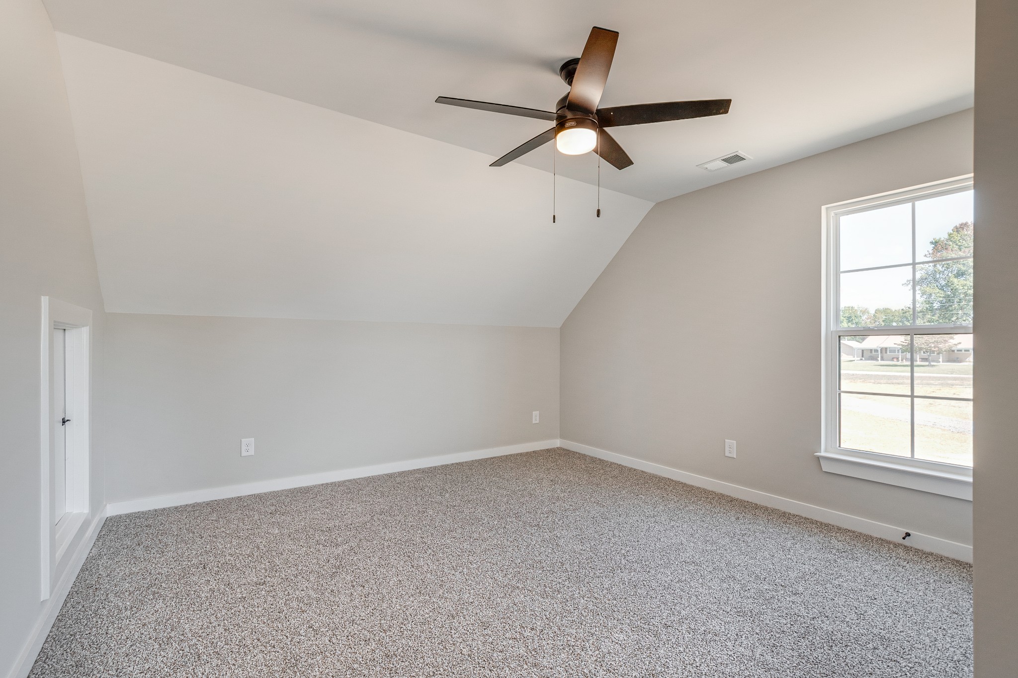 483 Meadows Road Portland, TN 37148 - Photo 24 of 29 an empty room with a ceiling fan and windows