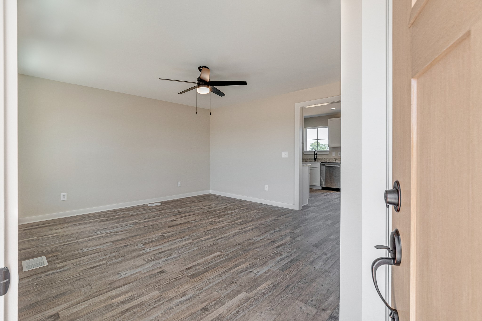 483 Meadows Road Portland, TN 37148 - Photo 5 of 29 a view of empty room with wooden floor and ceiling fan