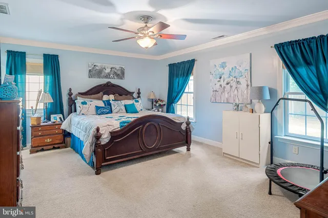 a bedroom with a bed and a dresser in it