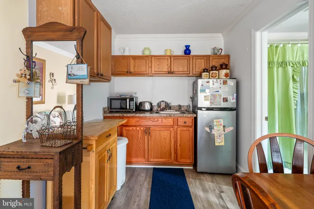 a bathroom with a sink a mirror and a shower