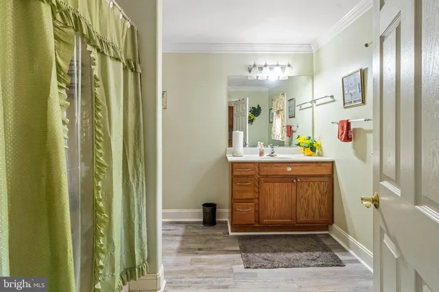 a living room with furniture a fireplace and a window