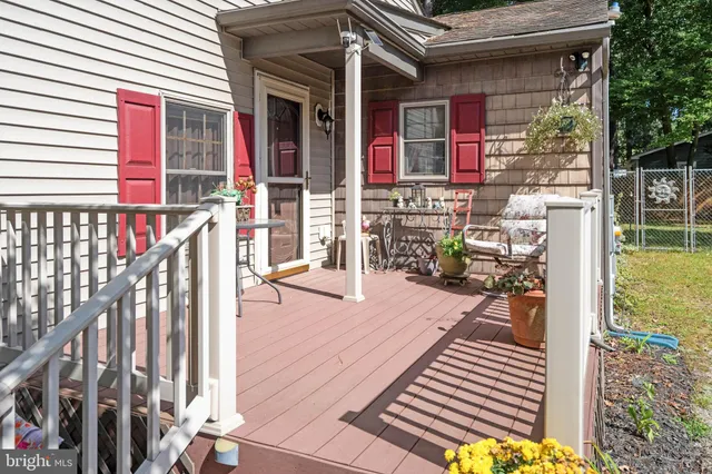 a view of a balcony with wooden floor