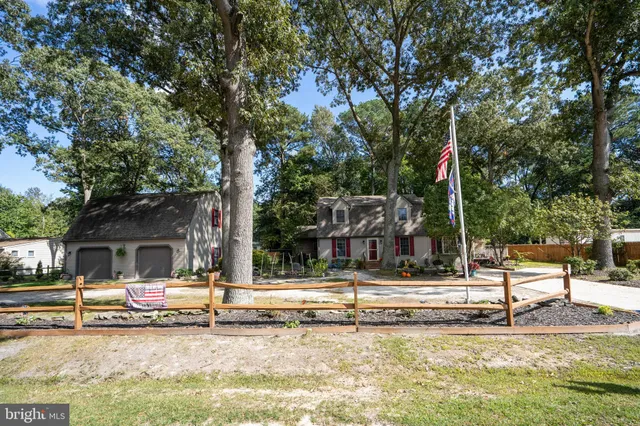 a view of swimming pool with sitting area and garden