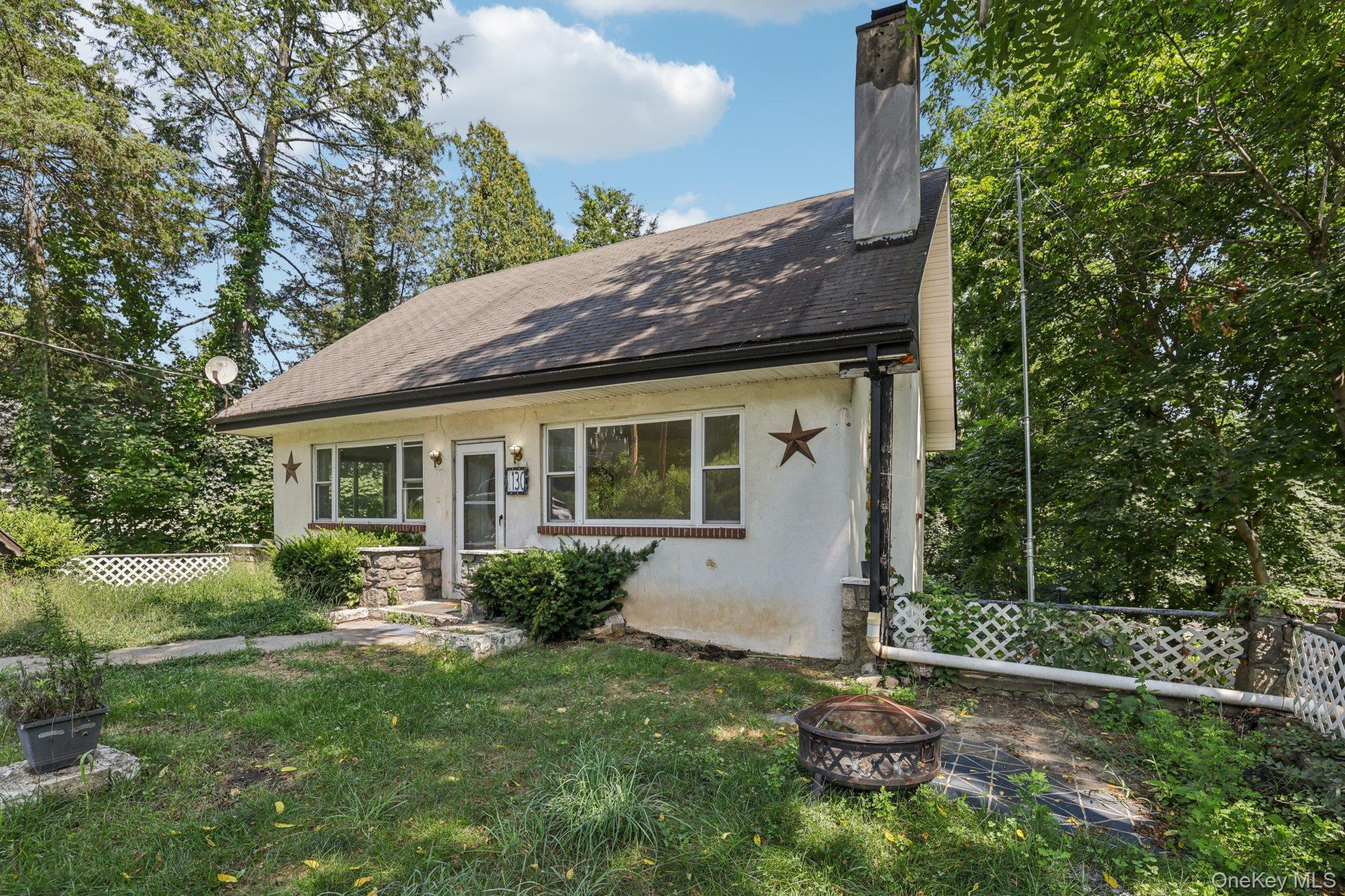 130 Hewitt Street Lake Peekskill, NY 10537 - Photo 1 of 1 a view of a house with a yard and plants