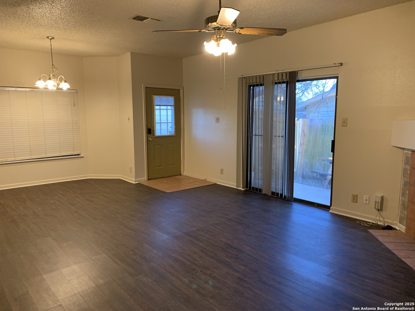 8441 Forest Ridge Drive, Unit 80 San Antonio, TX 78239 - Photo 4 of 10 a view of a room with wooden floor and ceiling fan