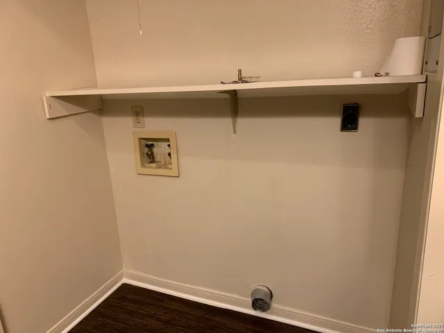 a view of a sink with wooden floor