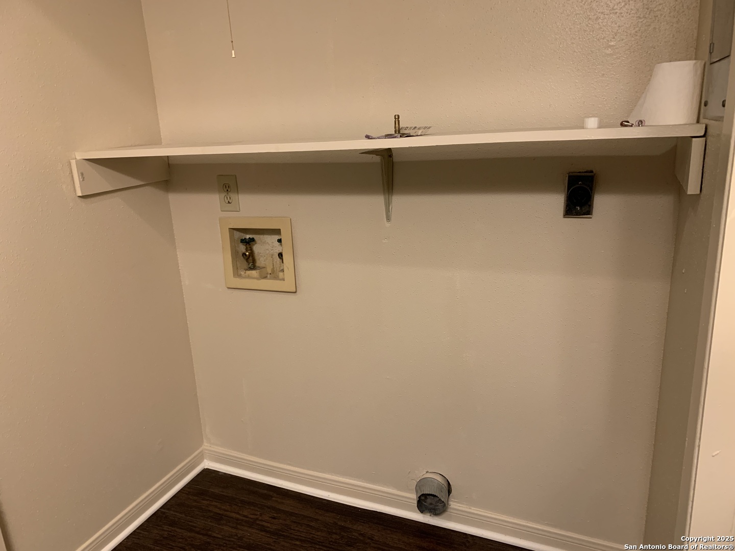 8441 Forest Ridge Drive, Unit 80 San Antonio, TX 78239 - Photo 6 of 10 a view of a sink with wooden floor