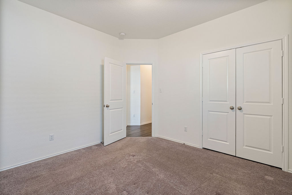 156 Red Buckeye Loop Liberty Hill, TX 78642 - Photo 13 of 27 a view of an empty room