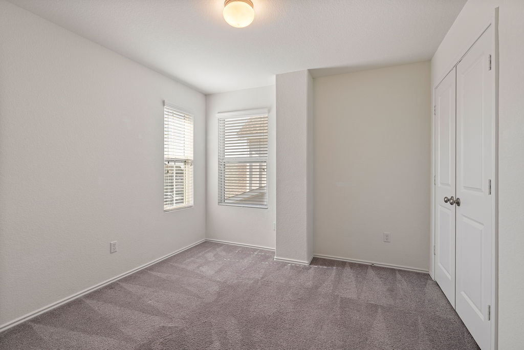 156 Red Buckeye Loop Liberty Hill, TX 78642 - Photo 17 of 27 a view of an empty room with a window