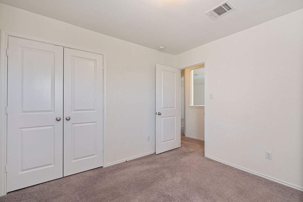 156 Red Buckeye Loop Liberty Hill, TX 78642 - Photo 20 of 27 a view of an empty room and closet area