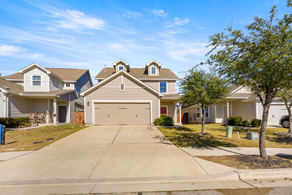 156 Red Buckeye Loop Liberty Hill, TX 78642 - Photo 2 of 27 a front view of a house with a yard