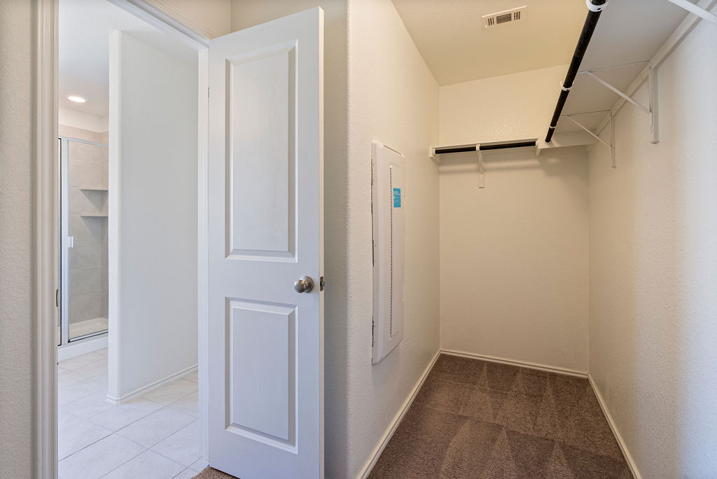 156 Red Buckeye Loop Liberty Hill, TX 78642 - Photo 24 of 27 a view of hallway with shower