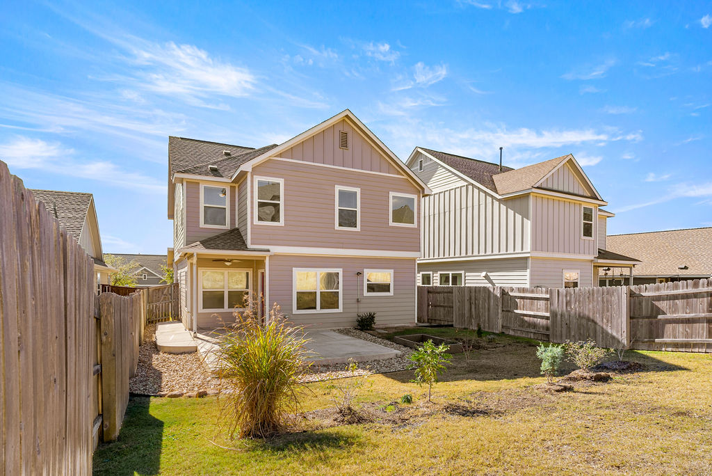 156 Red Buckeye Loop Liberty Hill, TX 78642 - Photo 26 of 27 a front view of a house with a yard
