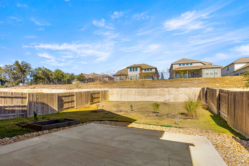 156 Red Buckeye Loop Liberty Hill, TX 78642 - Photo 27 of 27 a front view of residential houses with yard
