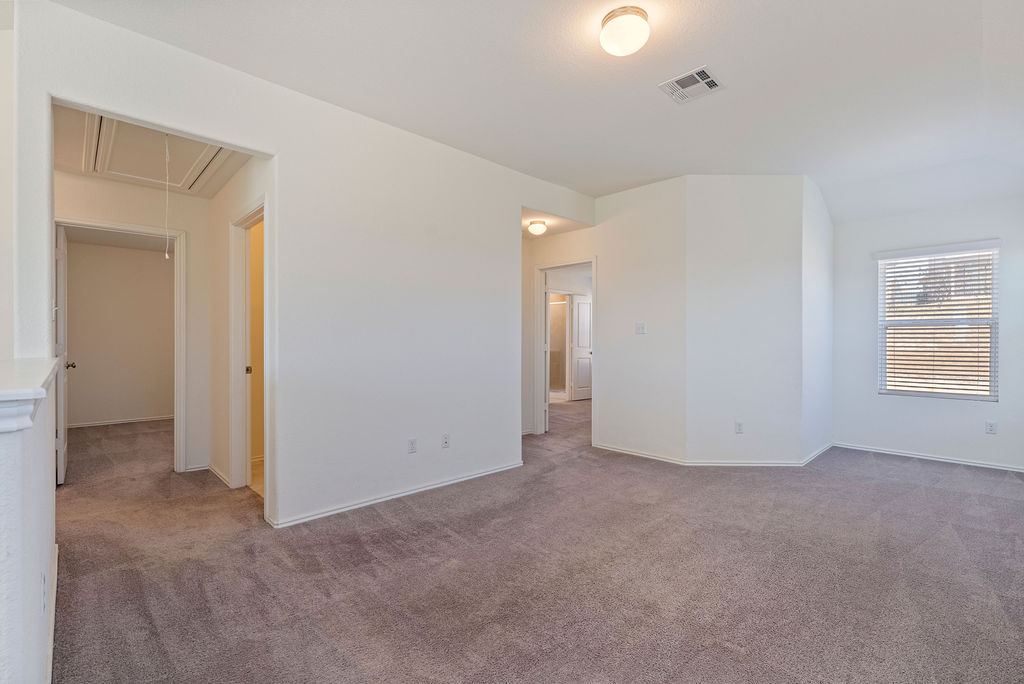 156 Red Buckeye Loop Liberty Hill, TX 78642 - Photo 10 of 27 an empty room with windows and closet