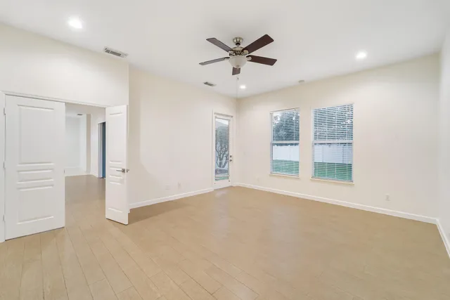 a view of an empty room with a window