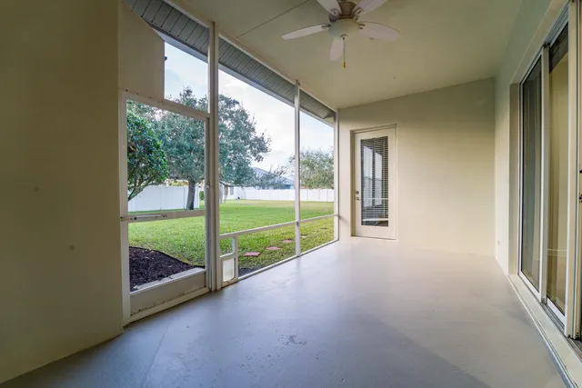 a view of a chairs and table in a backyard