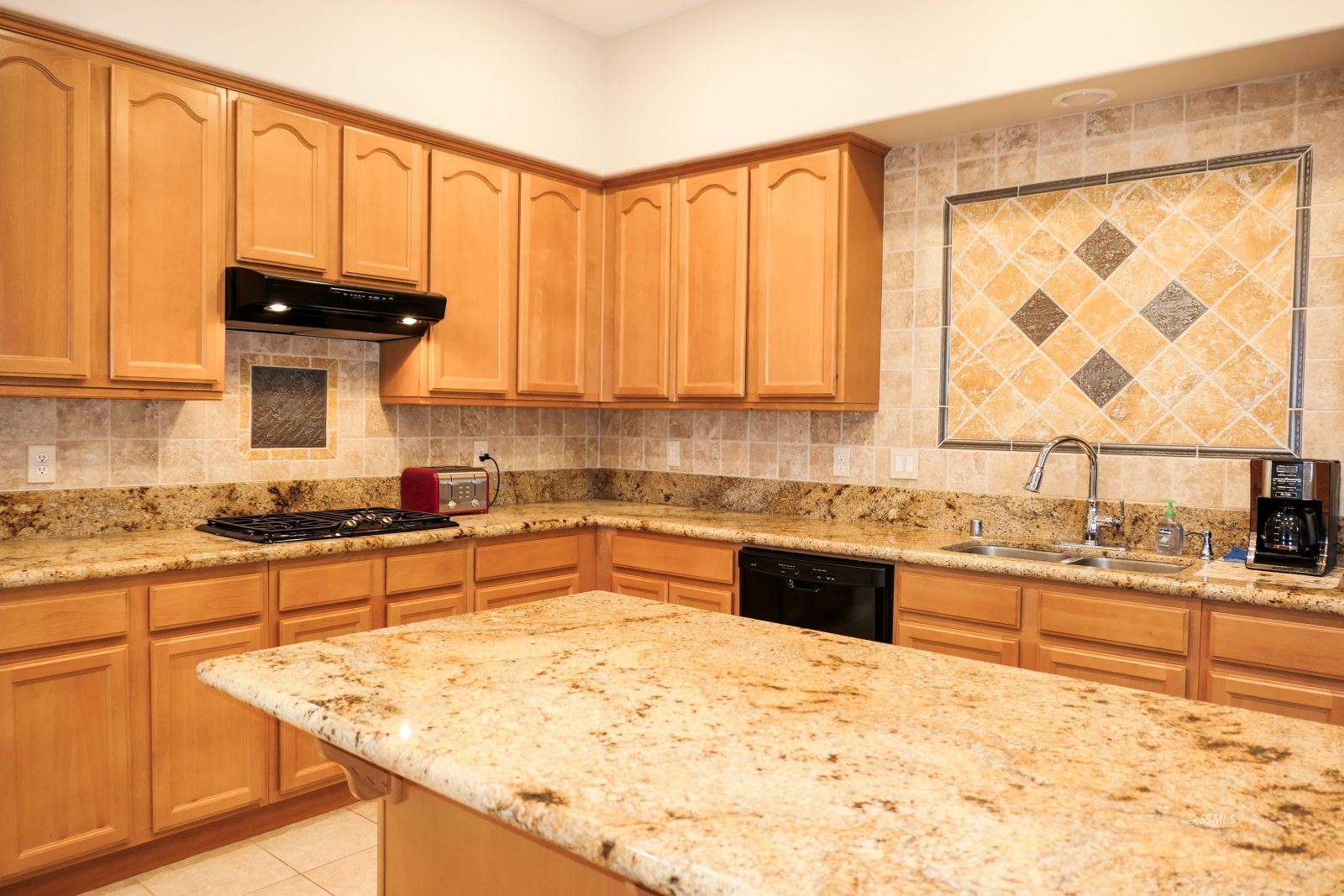 120 West Franklin Avenue Ridgecrest, CA 93555 - Photo 12 of 49 a kitchen with stainless steel appliances granite countertop a stove a sink and a microwave