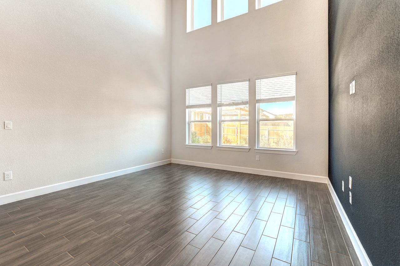 4705 Sea Salt Drive Austin, TX 78747 - Photo 14 of 40 wooden floor in an empty room with a window
