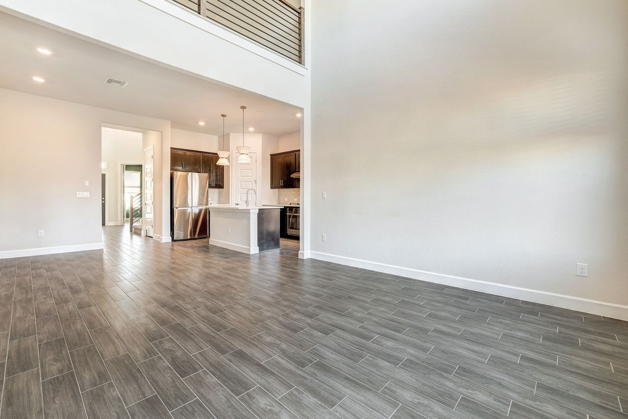 4705 Sea Salt Drive Austin, TX 78747 - Photo 15 of 40 a view of empty room with wooden floor