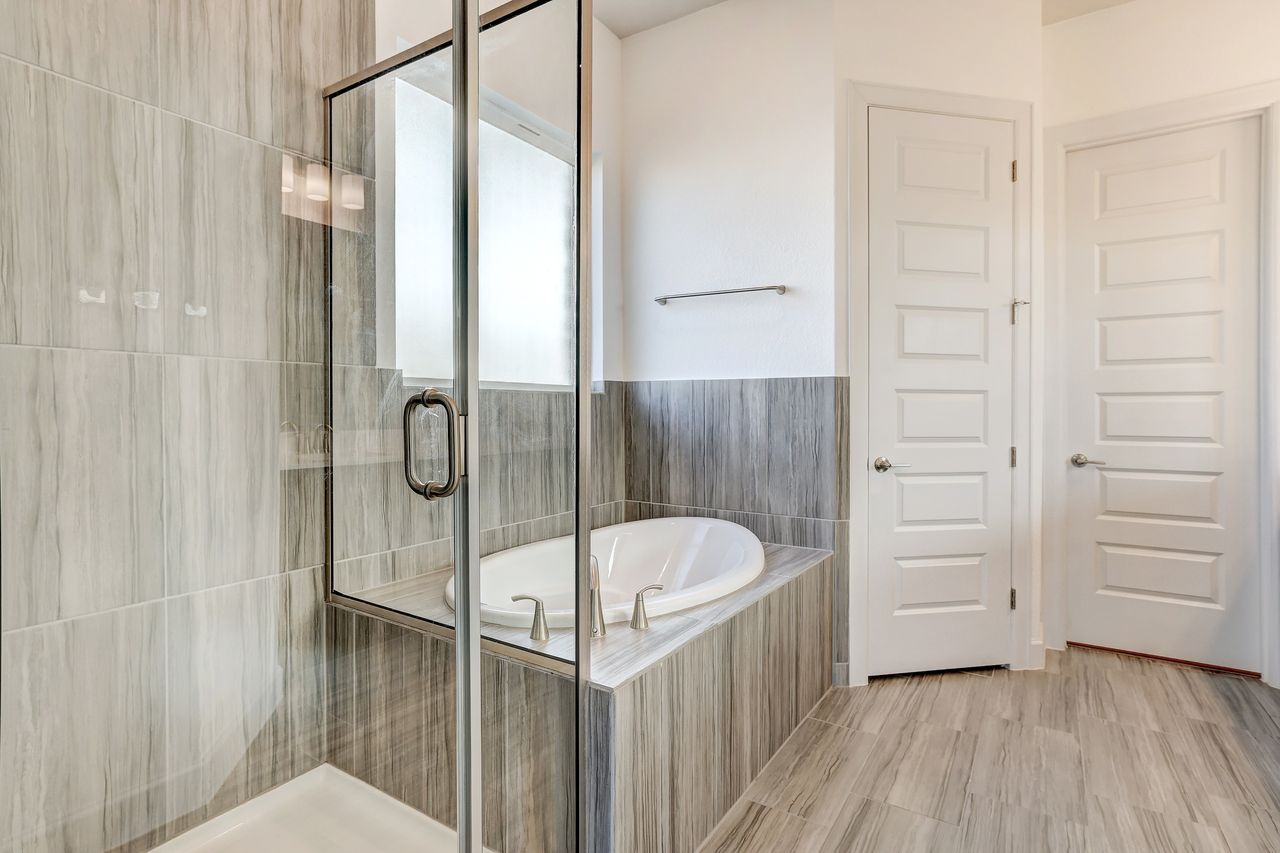 4705 Sea Salt Drive Austin, TX 78747 - Photo 20 of 40 a bathroom with a bathtub and a shower