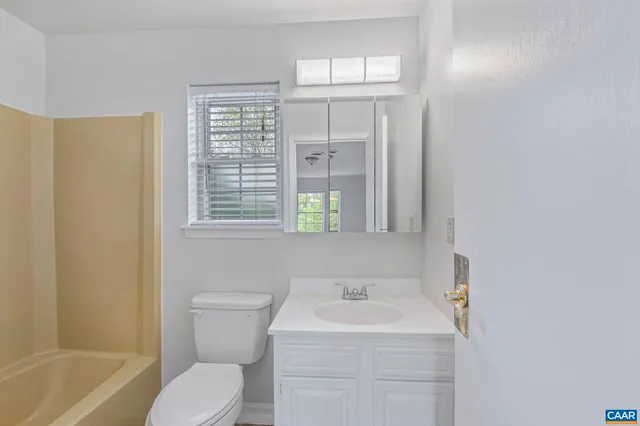 a bathroom with a sink toilet and a bathtub