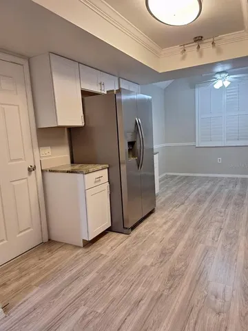 a kitchen with stainless steel appliances a refrigerator and a stove
