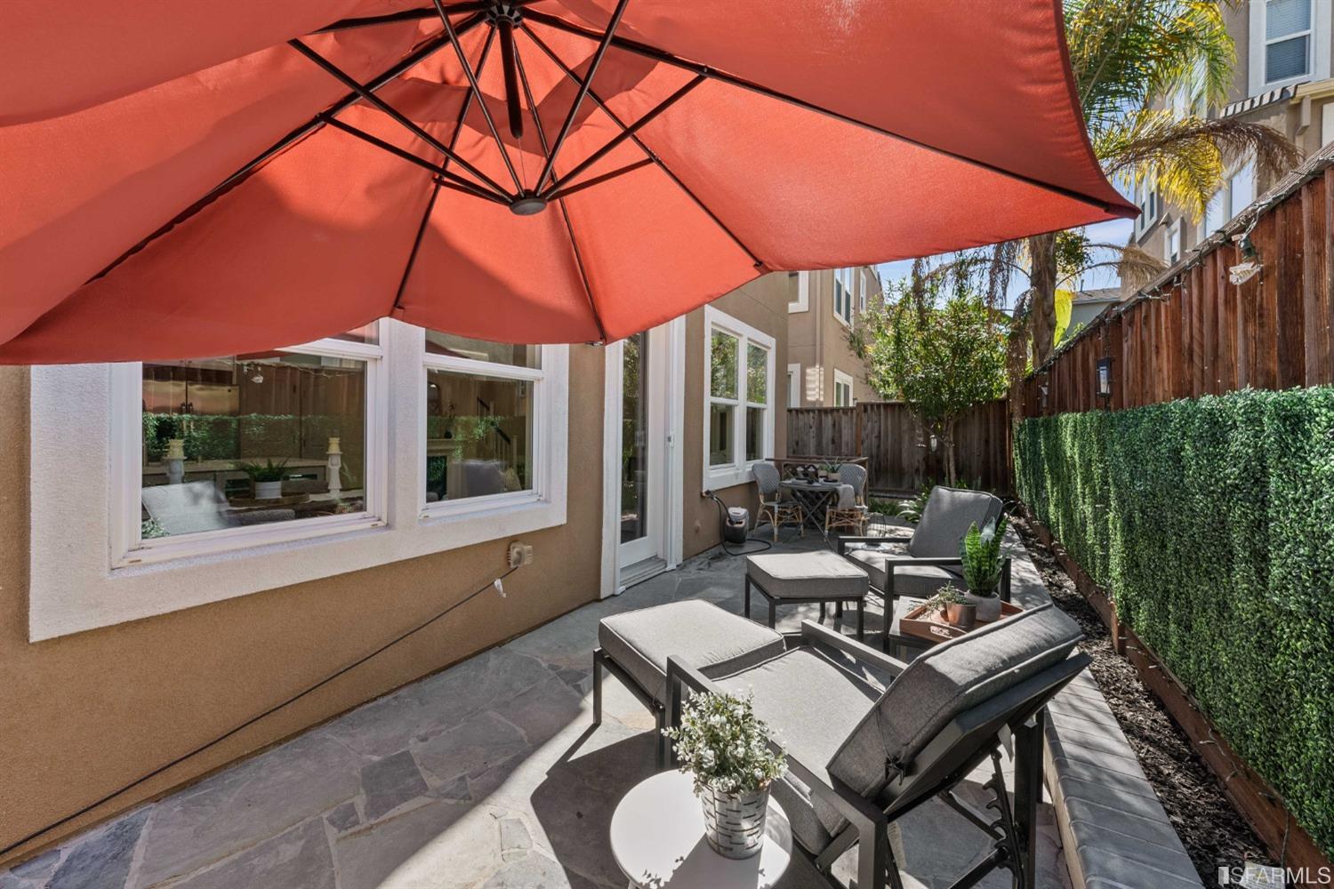 3547 Meyer Place Santa Clara, CA 95051 - Photo 30 of 34 a patio with a table and chairs under an umbrella