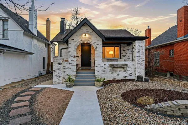 a front view of a house with entertaining space