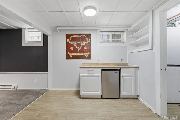 a kitchen with stainless steel appliances granite countertop a stove and a refrigerator
