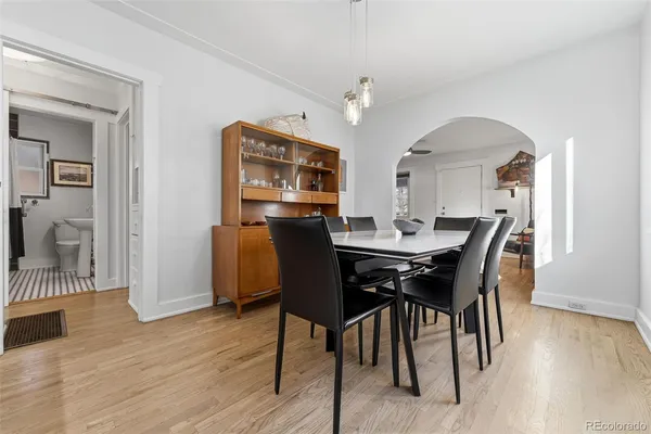 a view of a dining room with furniture and wooden floor
