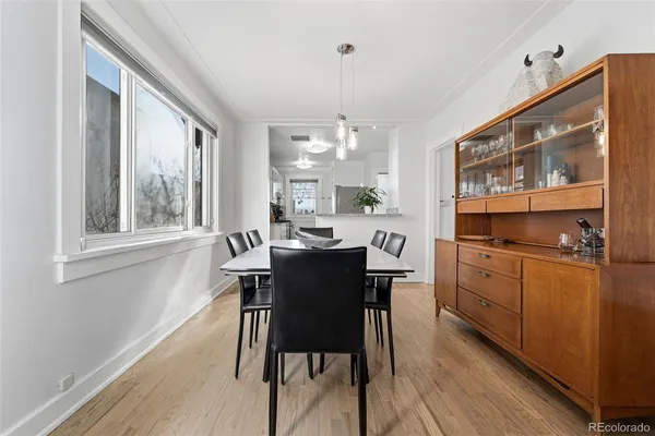 a view of a dining room with furniture window and wooden floor