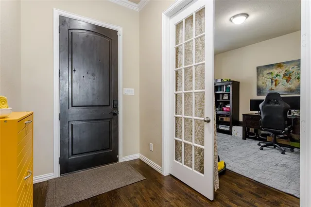 a view of a hallway with workspace and closet
