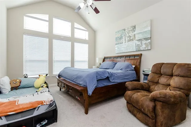 a bedroom with furniture and a window